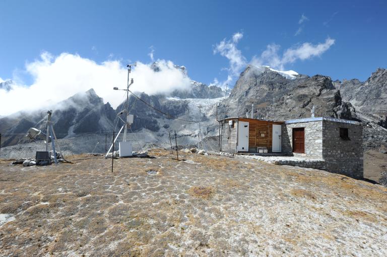 A small house on top of a mountain.