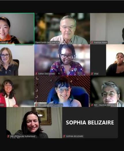 A group of people in a video conference, each in individual screen tiles, smiling and engaged. Names are displayed on the screen.